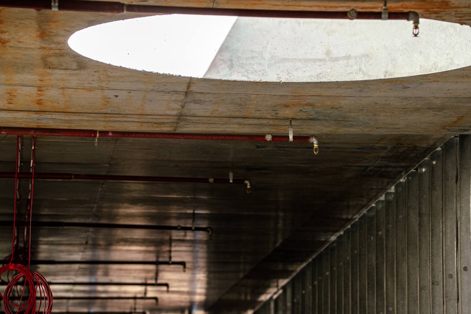 Sprinkler pipework below a concrete void, Manly